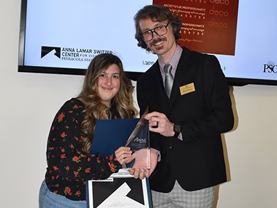 Student artist receives award at Pensacola State College art event.