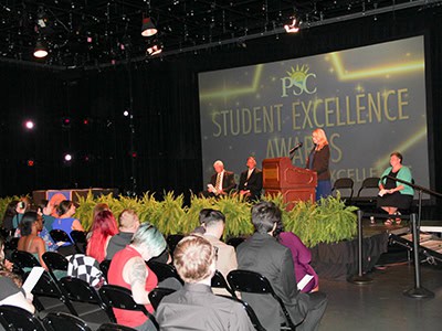 Celebrating top students during the PSC Student Excellence Awards Ceremony in a formal event setting.