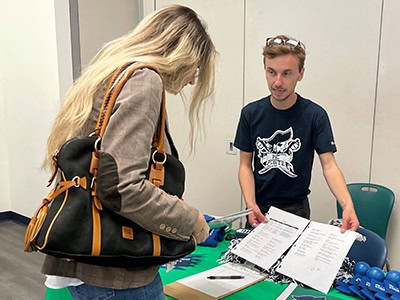 Student engagement and leadership coordinator welcoming new students.