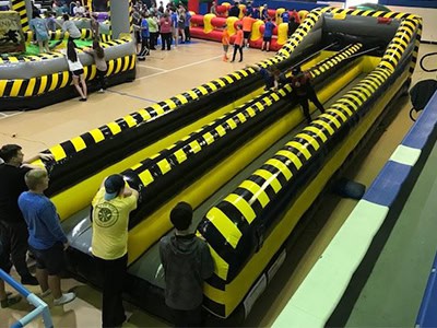 Inflatable human foosball game at Pirate Fest 2023 showcasing fun activities for college students an.