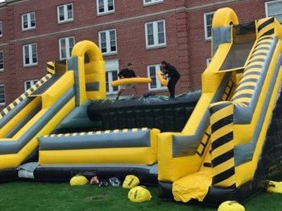 Inflatable human foosball game with participants playing during Pirate Fest 2023 event.