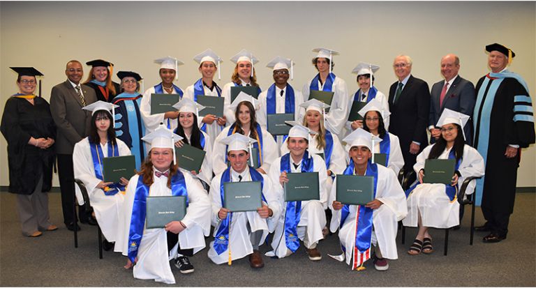 Senior graduates celebrating at the first graduation ceremony of PSC Charter Academy.