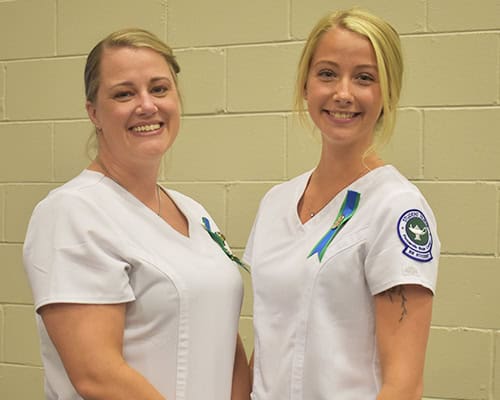 Nursing students and family celebrating graduation achievement at Pensacola State College.