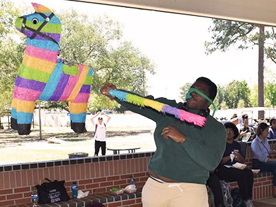 Vibrant pi&ntilde;ata llama for Finals Week festivities at Pensacola State College campus.