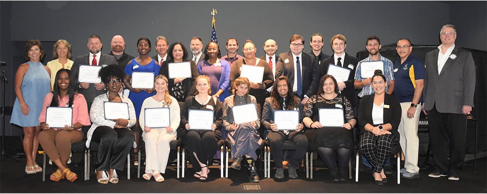 Diverse group of Pensacola State students receiving Cantonment Rotary Club scholarships.