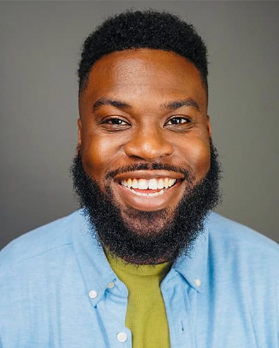 Portrait of a smiling African American college staff member for Pensacola State College staff profil.
