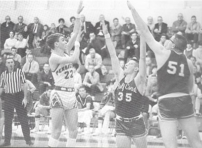 Female basketball players in action during Pensacola State College's 75th anniversary celebration.