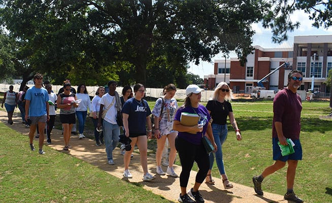 Group of diverse students participating in campus tour at Pensacola State College.