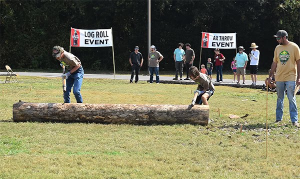 Log roll and axe throwing competitions at Pensacola State College Milton campus Lumberjack Fest.