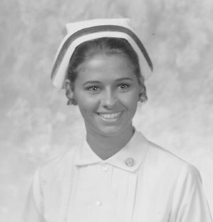 Pensacola State College graduate in cap and gown at 75th anniversary event.