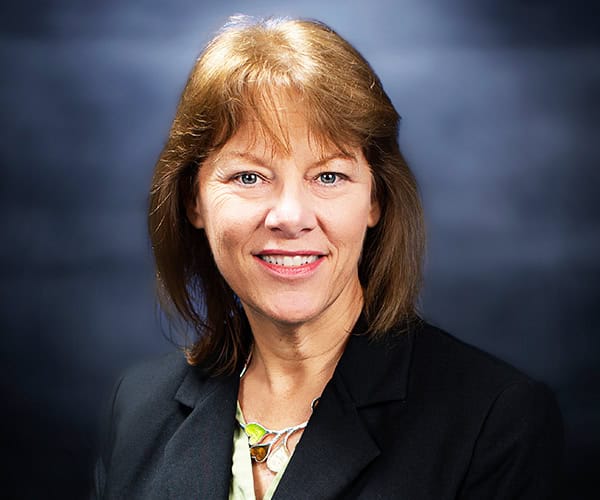 Woman smiling, promoting Pensacola State&rsquo;s nonprofit certification programs.