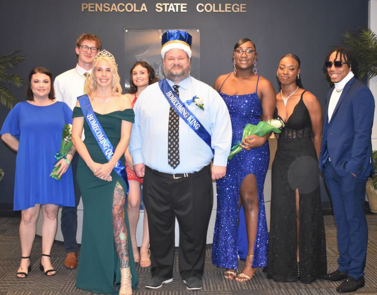 Group of diverse students and faculty celebrating PSC Homecoming 2024 in formal attire.