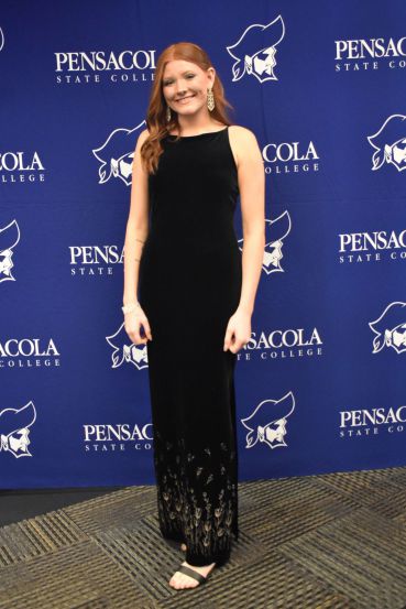 Graduation gown worn by student at Pensacola State College ceremony.