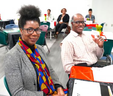 Diverse group of students and faculty honoring Black History Month at Pensacola State College.