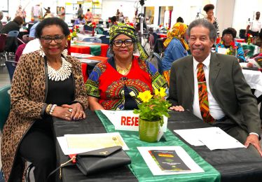 Diverse community leaders celebrating Black History Month at Pensacola State College event.