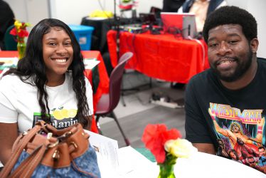 Diverse students celebrating Black History Month at Pensacola State College event.