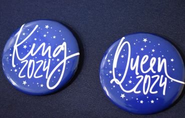 Two blue buttons with white text and star designs, reading "King 2024" and "Queen 2024.".