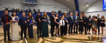 Group of students and faculty celebrating academic achievements at Pensacola State College honors ev.