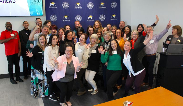 Diverse group of nonprofit professionals celebrating graduation from the first certification program.