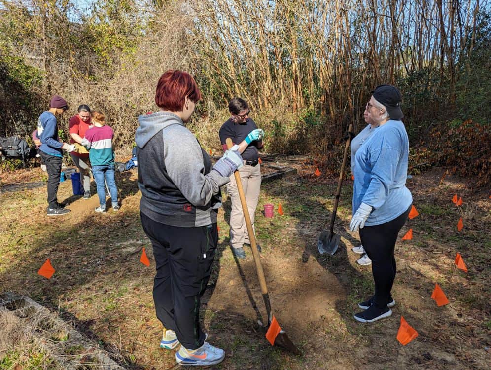 Field 2: Crime Scene Technician students locate and examine carcass during annual pig dig on Milton.