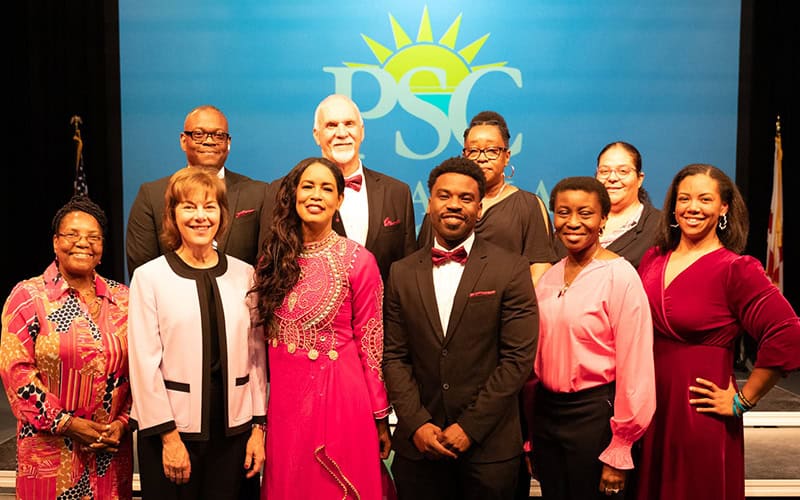 Pensacola State College students receiving Garrett T. Wiggins endowed scholarships at a formal event.