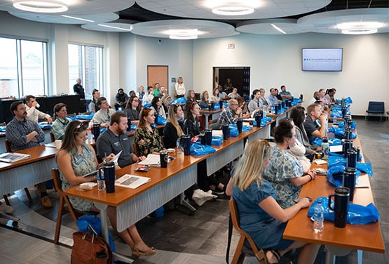 Leadership Pensacola 2024 class at PSC and UWF cohosted event in a modern conference room.