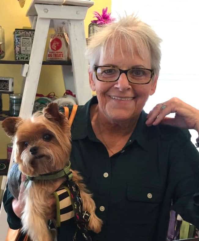 Nan Greenhut James with her dog, a tribute to her friendship and dedication at Pensacola State Colle.