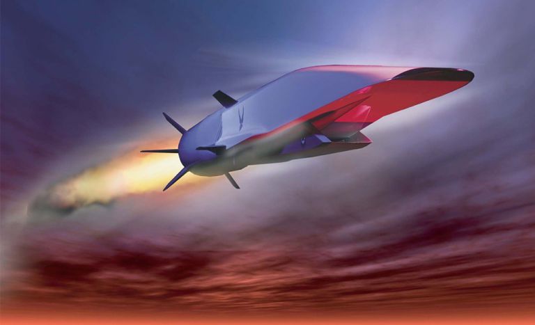 Advanced manufacturing research rocket taking off at sunset.