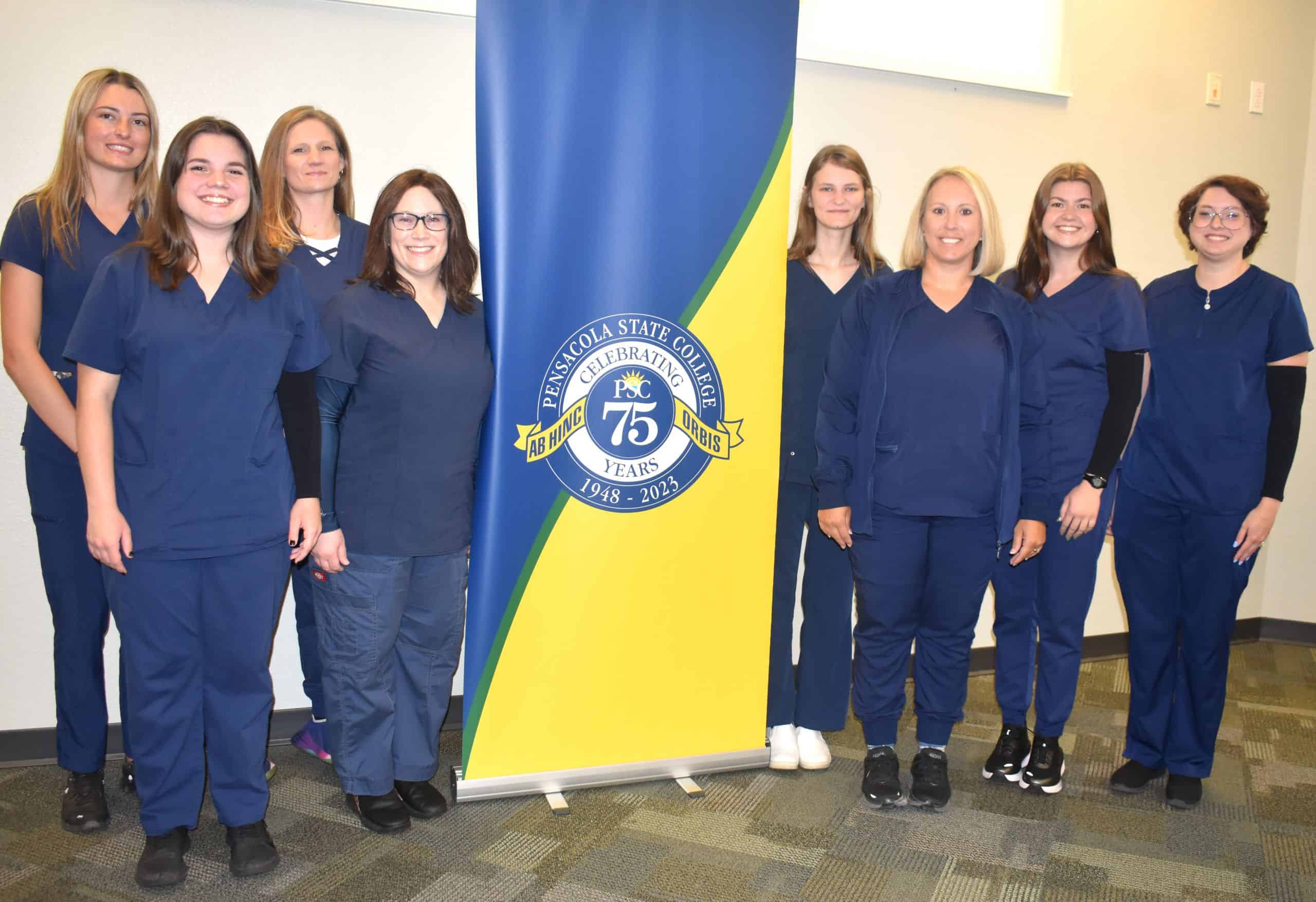 Allied Health Pinnings ceremony at Pensacola State College with students in scrubs.