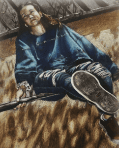 Vibrant portrait of a high school artist displayed at Pensacola State College art exhibit.