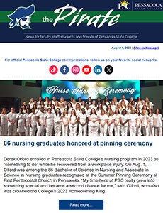 Group of nursing graduates in white uniforms at Pensacola State College pinning ceremony.