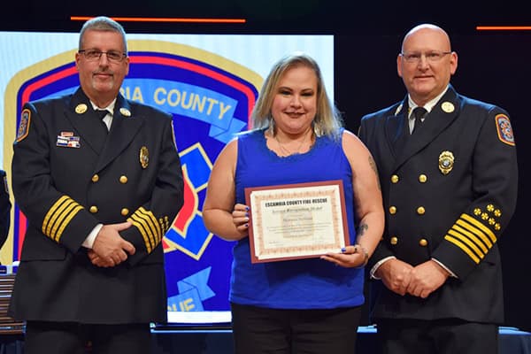 Escambia County Fire Rescue service award presented to Pensacola State College graduate.