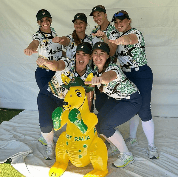 All-female Pensacola State College softball team at Softball World Cup, showcasing athletic excellen.