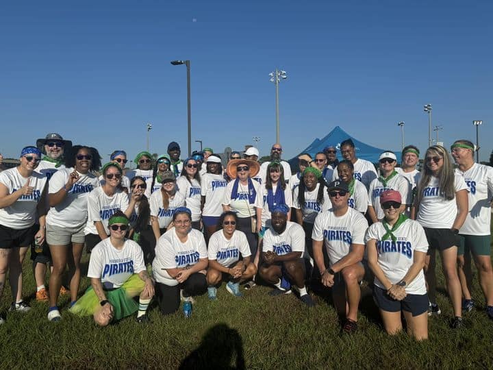 YMCA Corporate Cup team participating in a competitive event at Pensacola State College.