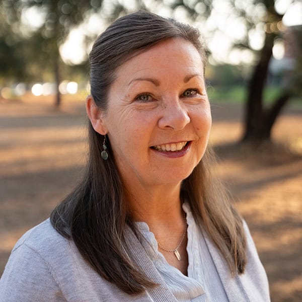 Portrait of college marketing coordinator at Pensacola State College outdoors.