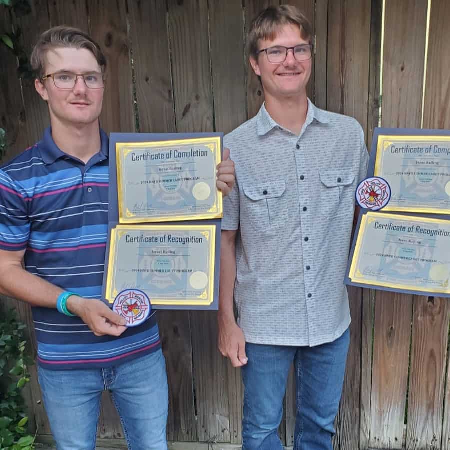 Students proudly display their certificates of completion and recognition during Fall 2024 graduatio.
