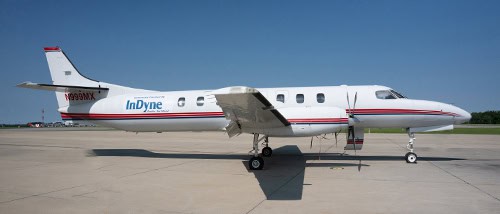 Private jet on airport tarmac at Pensacola State College campus.