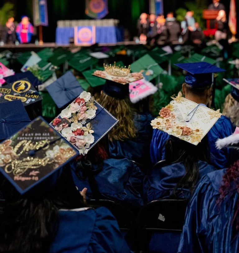 Colorful graduation caps with floral embellishments at Pensacola State College Spring Graduation 202.
