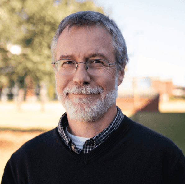 Highly skilled faculty member receiving Teaching Excellence Award at Pensacola State College campus.