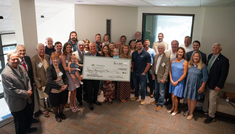 Group photo of scholarship recipients and donors at Pensacola State College Foundation event.