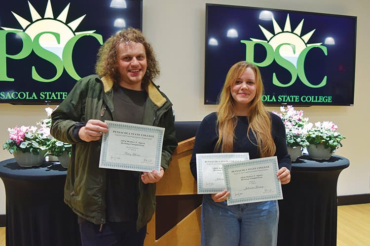 Young students holding certificates during PSC literary journal event.