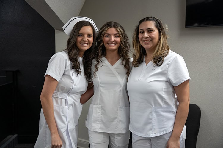 Nursing students at Pensacola State College in uniform, highlighting top online education.