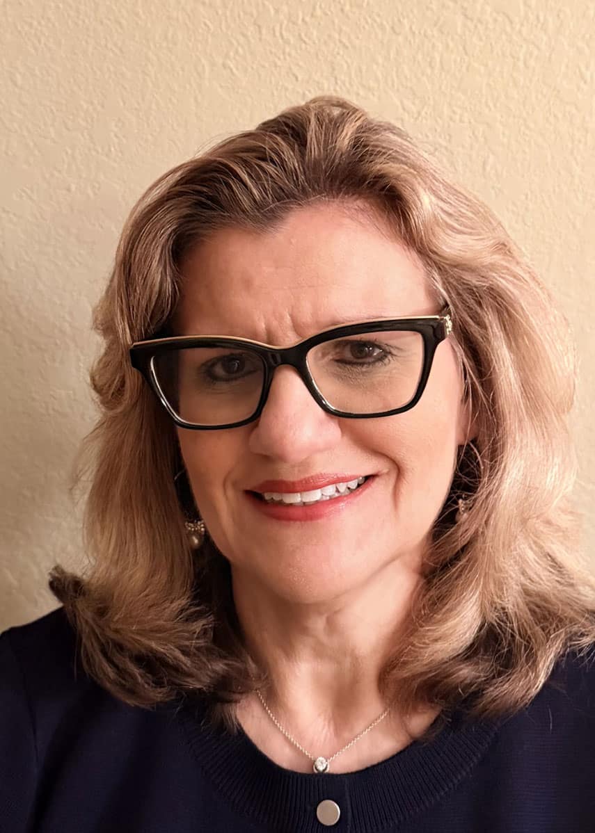 College advisor with glasses supporting student success at Pensacola State College, promoting higher.