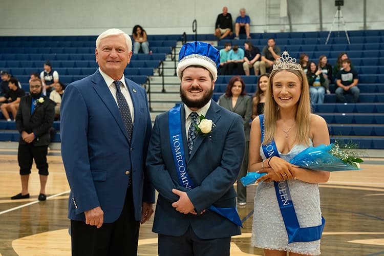 College homecoming court voting event at Pensacola State College gymnasium.